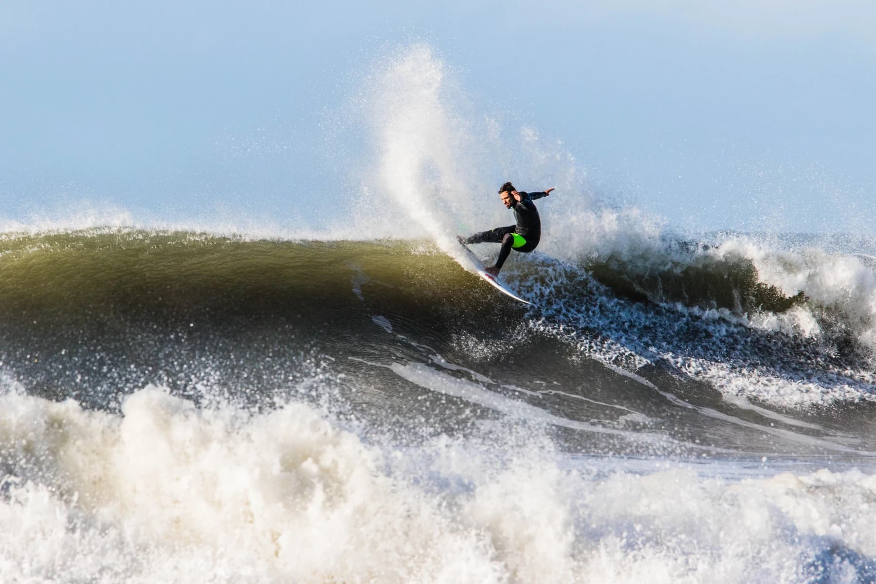 Surfer carving a wave